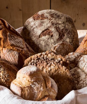 A basket with bread of various types